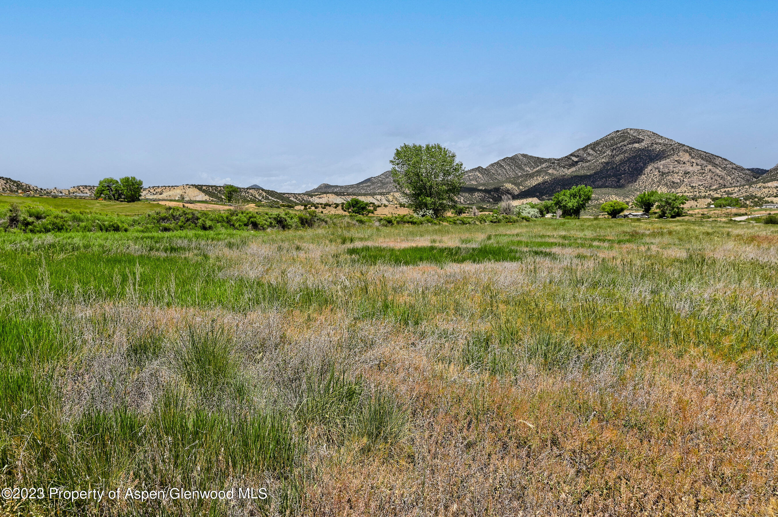 194 Scutter Lane Rifle, CO 81650 - Photo 6 of 32 a view of a lake in middle of green field