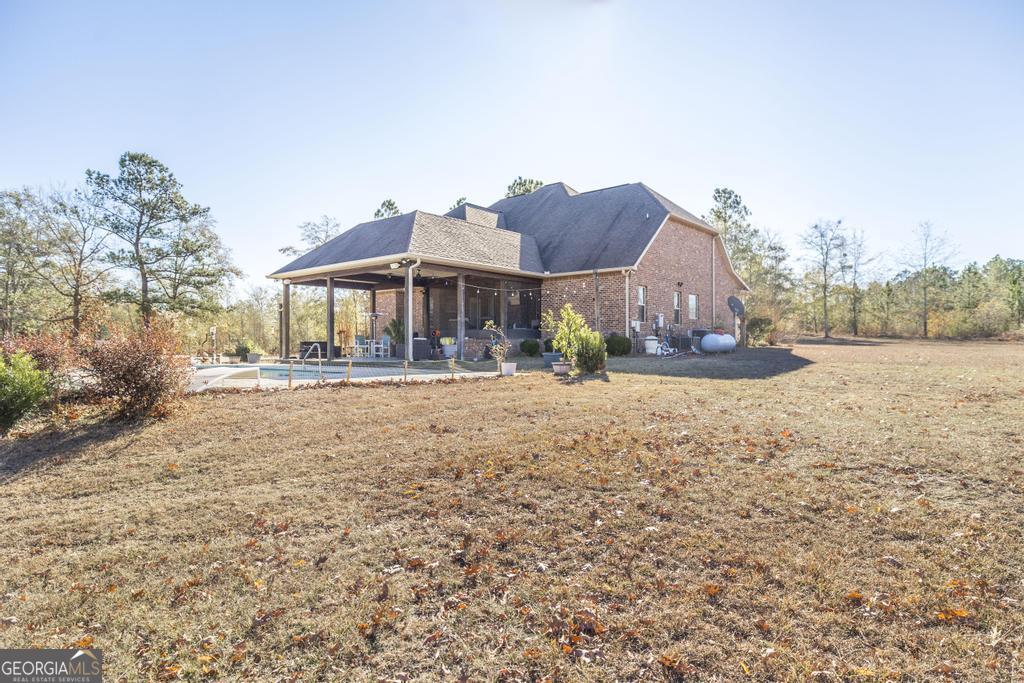 4065 Gordon Road Abbeville, GA 31001 - Photo 39 of 48 a front view of a house with a yard