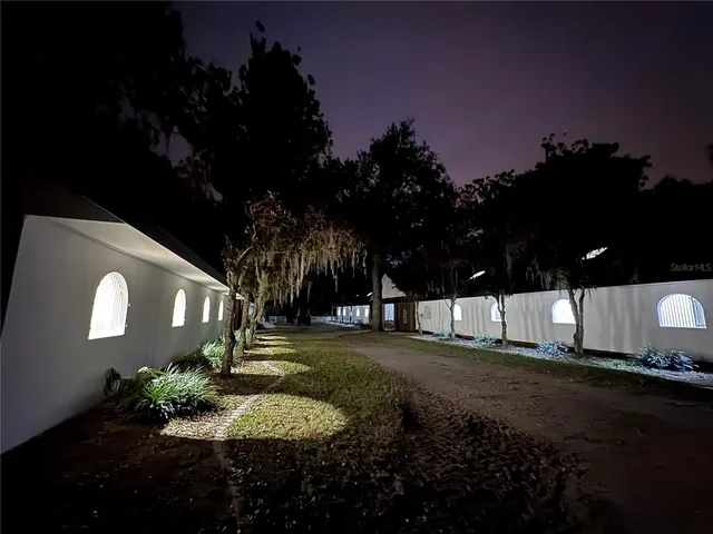 a view of a street both of side of building with green space