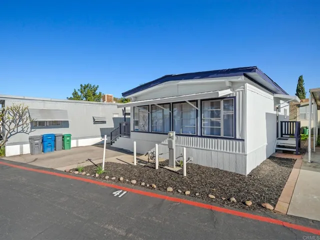 a front view of a house with a porch