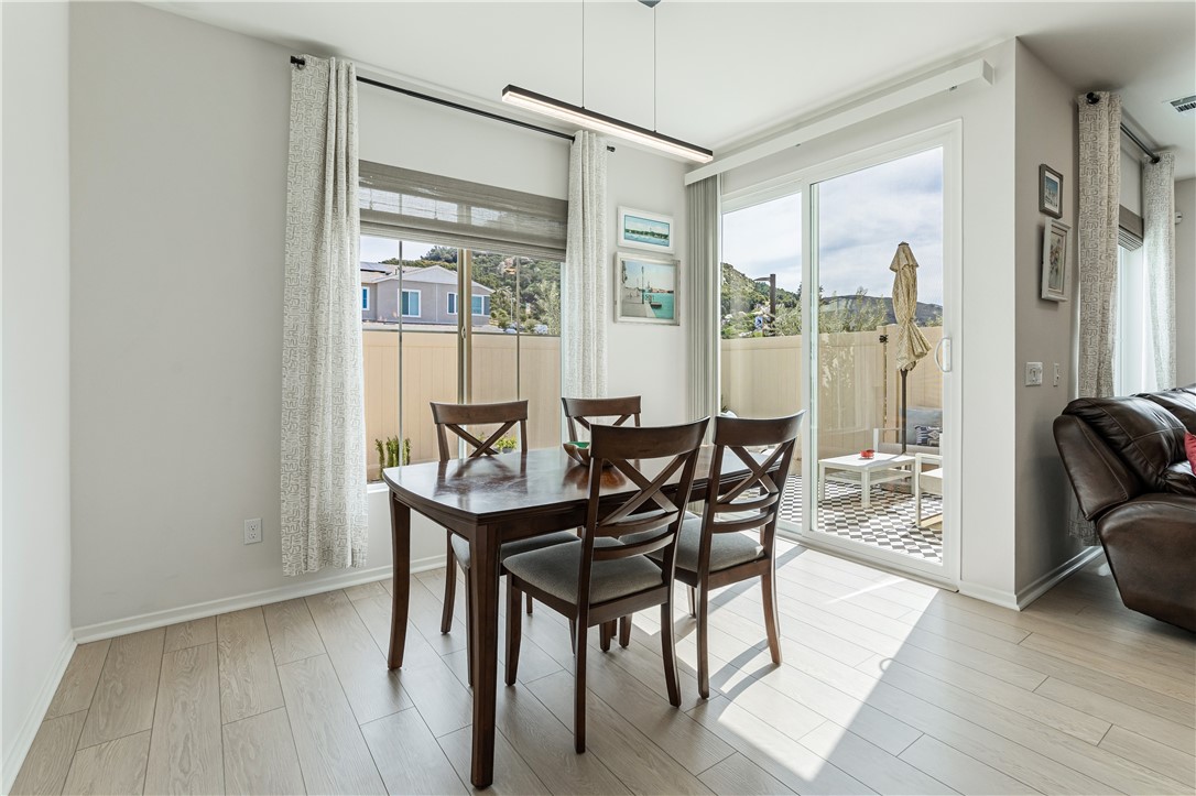 35103 Vintage Cove Fallbrook, CA 92028 - Photo 14 of 66 a dining room with furniture and wooden floor