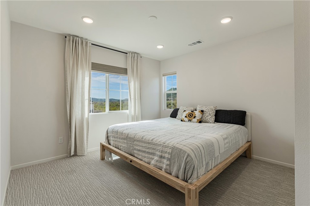 35103 Vintage Cove Fallbrook, CA 92028 - Photo 25 of 66 a bedroom with a bed and window
