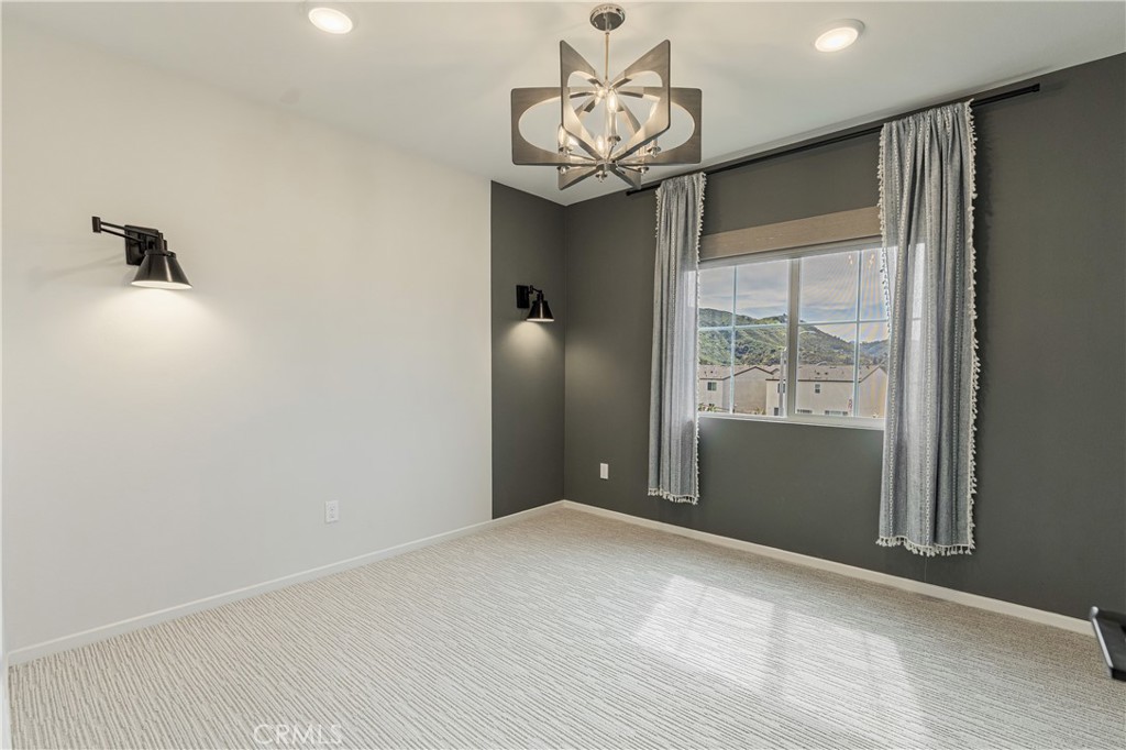 35103 Vintage Cove Fallbrook, CA 92028 - Photo 30 of 66 a view of an empty room with a chandelier