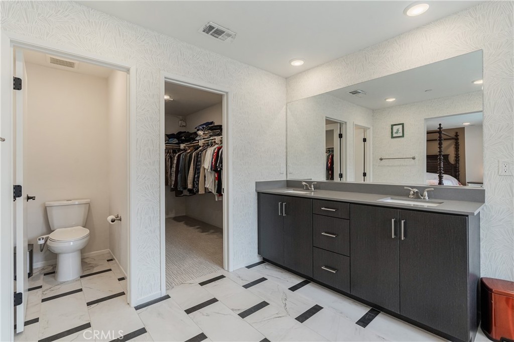 35103 Vintage Cove Fallbrook, CA 92028 - Photo 36 of 66 a spacious bathroom with a double vanity sink toilet and shower