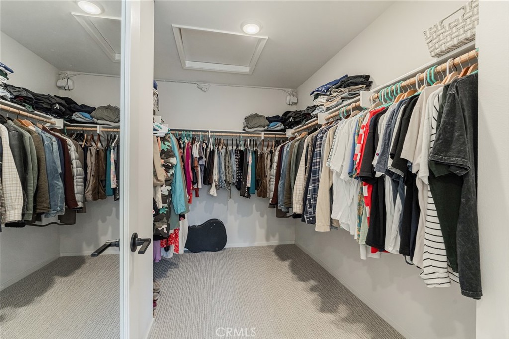 35103 Vintage Cove Fallbrook, CA 92028 - Photo 37 of 66 a view of walk in closet with clothes
