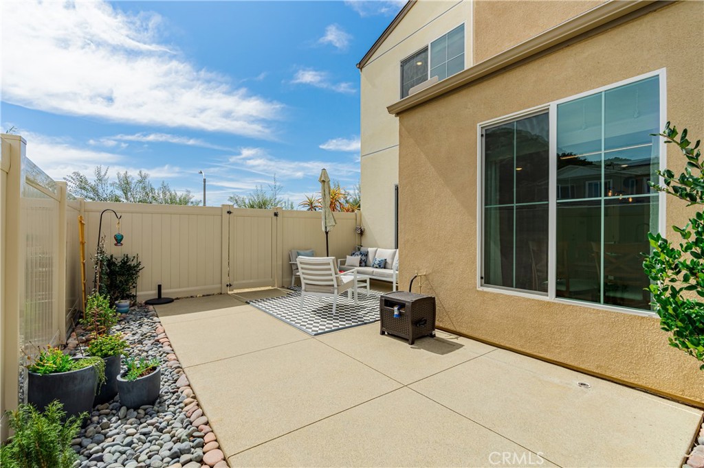 35103 Vintage Cove Fallbrook, CA 92028 - Photo 46 of 66 a view of a patio with a table and chairs and potted plants