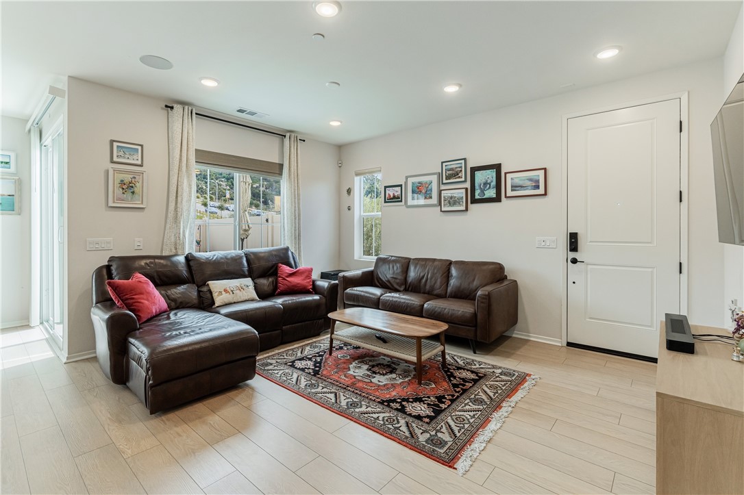 35103 Vintage Cove Fallbrook, CA 92028 - Photo 10 of 66 a living room with furniture a rug and a window