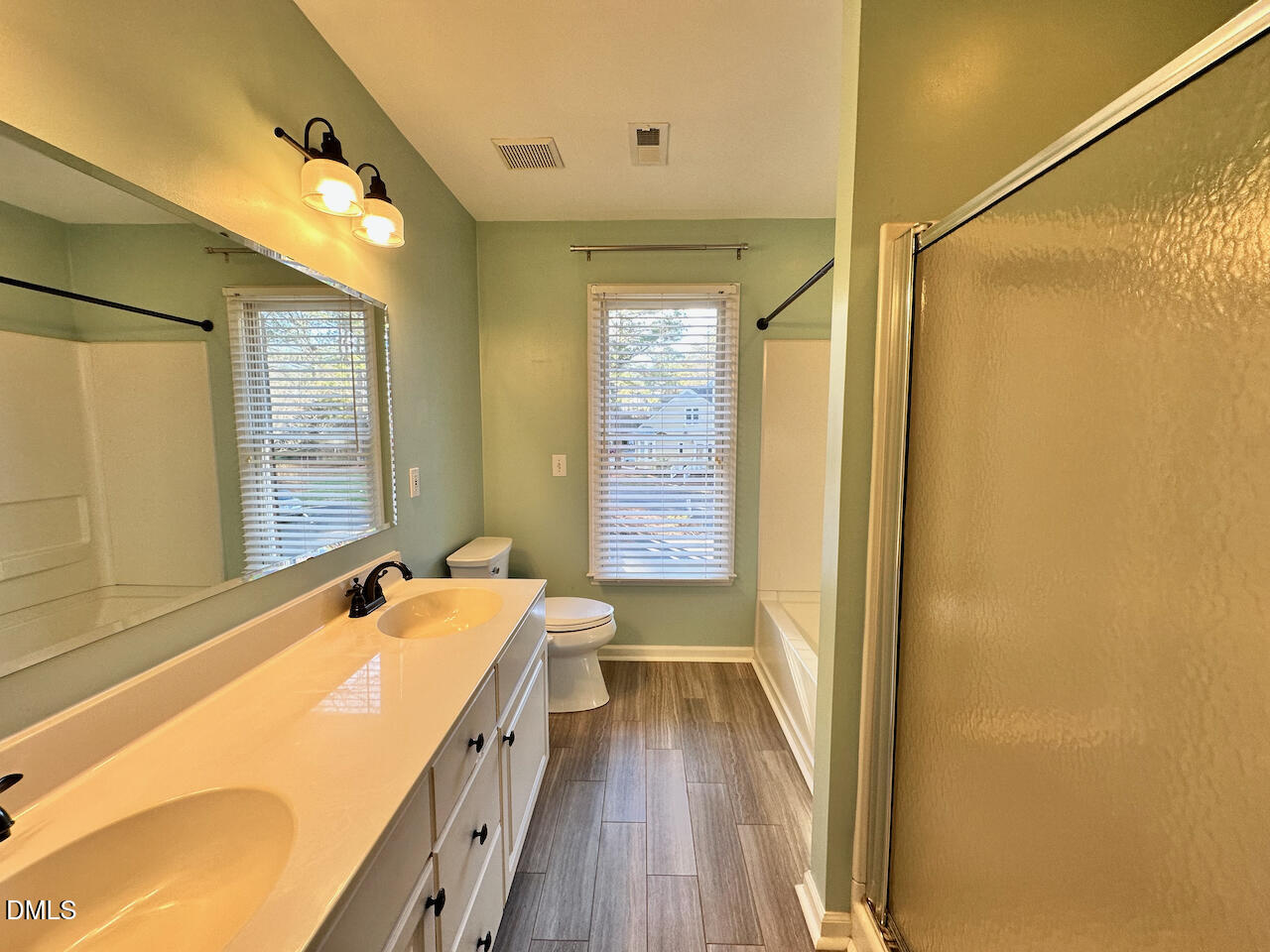 7020 Epping Forest Drive Raleigh, NC 27613 - Photo 17 of 24 a bathroom with a tub sink and mirror
