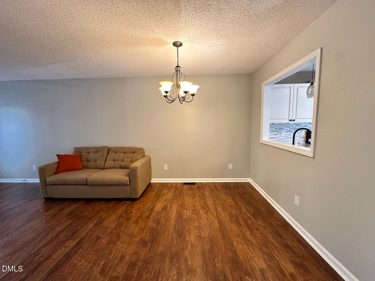 7020 Epping Forest Drive Raleigh, NC 27613 - Photo 6 of 24 a living room with furniture and a wooden floor