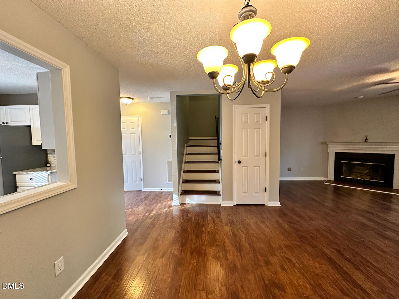 7020 Epping Forest Drive Raleigh, NC 27613 - Photo 7 of 24 a view of a hallway with wooden floor