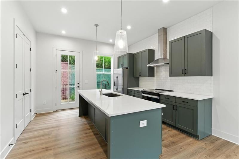 170 Color Circle Atlanta, GA 30317 - Photo 8 of 34 a kitchen with stainless steel appliances granite countertop a sink a stove and a refrigerator