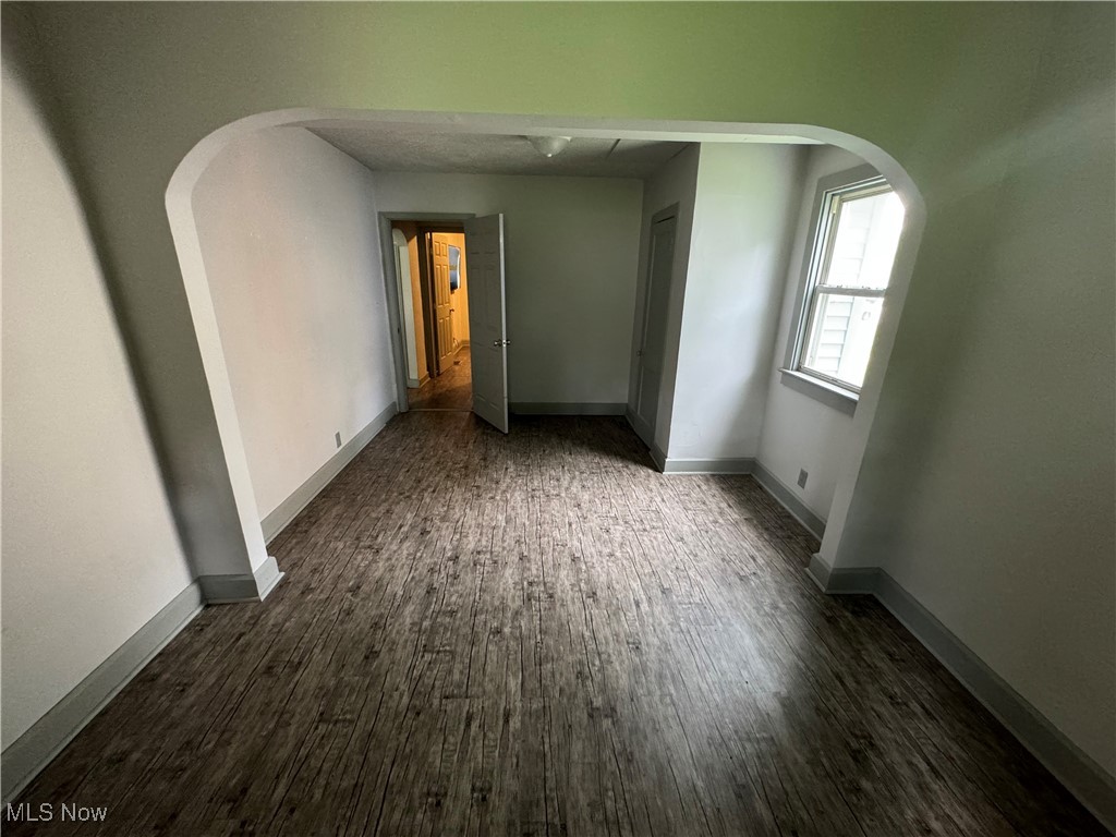 1920 South River Road Zanesville, OH 43701 - Photo 4 of 21 Unfurnished room with dark wood-type flooring