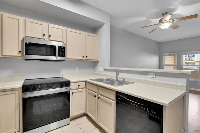 a kitchen with a sink and a refrigerator