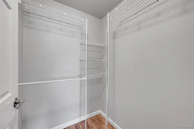 a bathroom with a sink a light fixture and a mirror