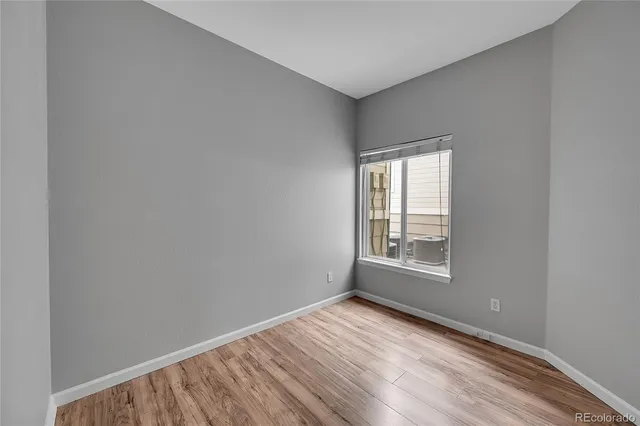 a view of wooden floor in an empty room