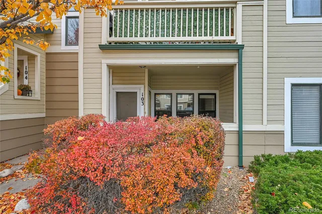 a view of a house with brick walls