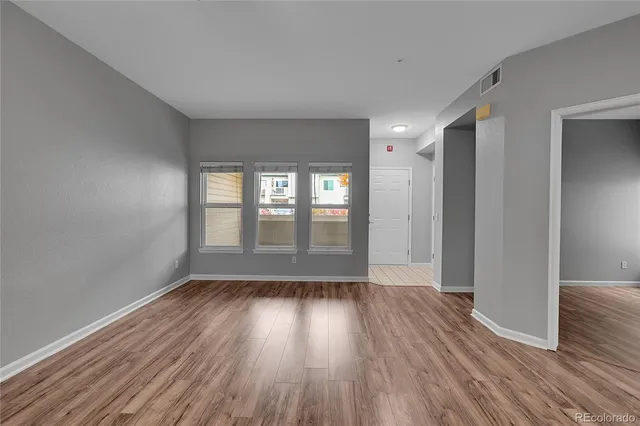 a kitchen with a refrigerator stove and microwave