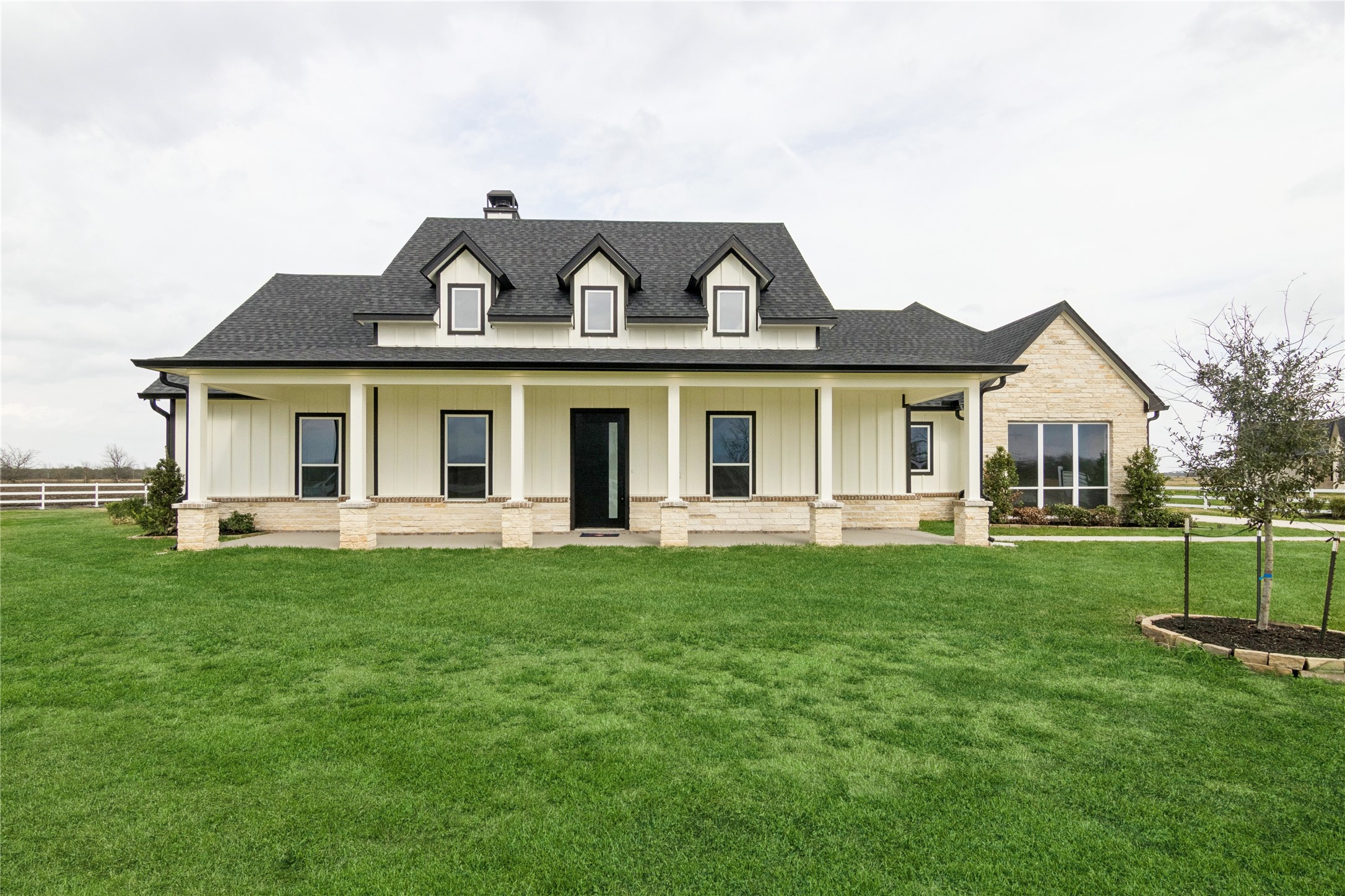 5766 Ward Bend Road Sealy, TX 77474 - Photo 1 of 45 a front view of a house with a garden