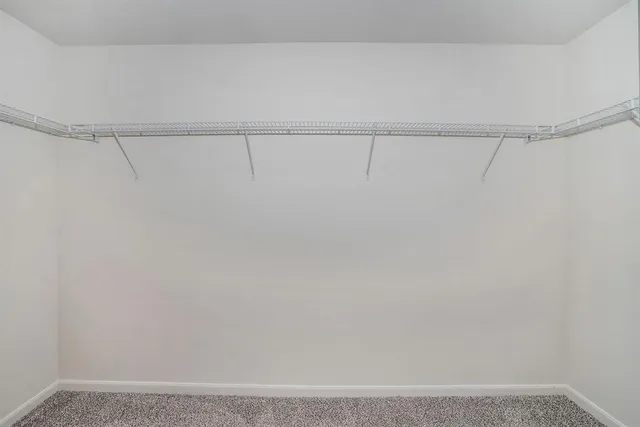 a bathroom with a granite countertop sink and a bathtub