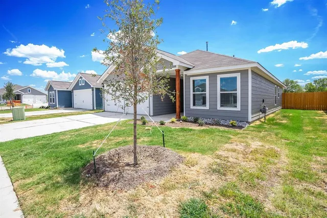 a view of a house with a big yard