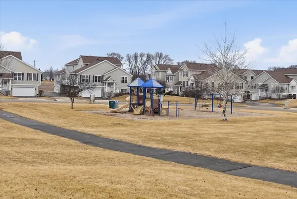 a view of a town with mountains in the background