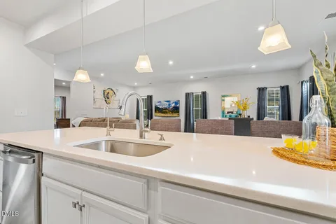 a kitchen with cabinets and stainless steel appliances