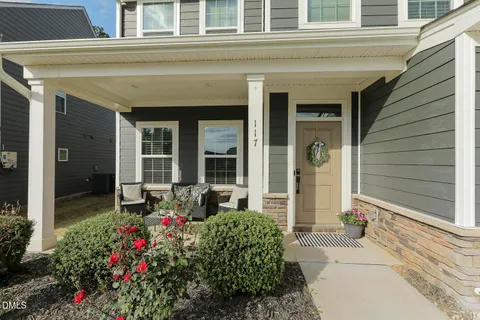 front view of a house with a fountain