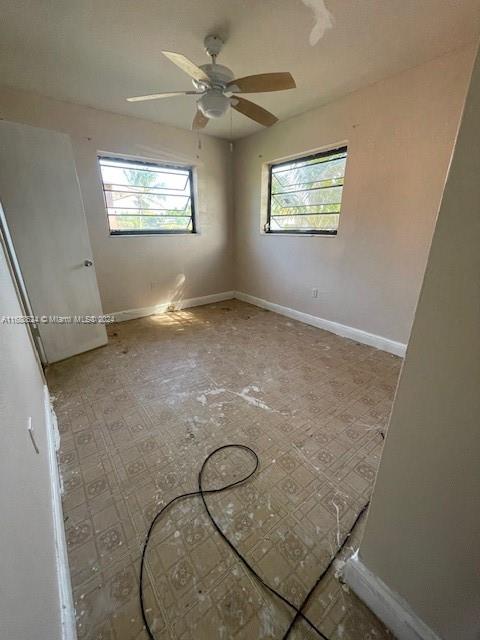 10791 Southwest 221st Street Miami, FL 33170 - Photo 12 of 18 a room with a fireplace and windows