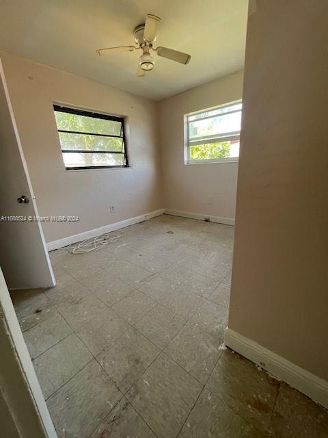 10791 Southwest 221st Street Miami, FL 33170 - Photo 13 of 18 a view of an empty room with a window