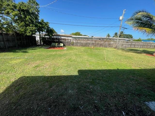 10791 Southwest 221st Street Miami, FL 33170 - Photo 15 of 18 a view of a swimming pool with an outdoor space and seating area