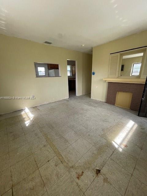 10791 Southwest 221st Street Miami, FL 33170 - Photo 4 of 18 a view of empty room with a fireplace