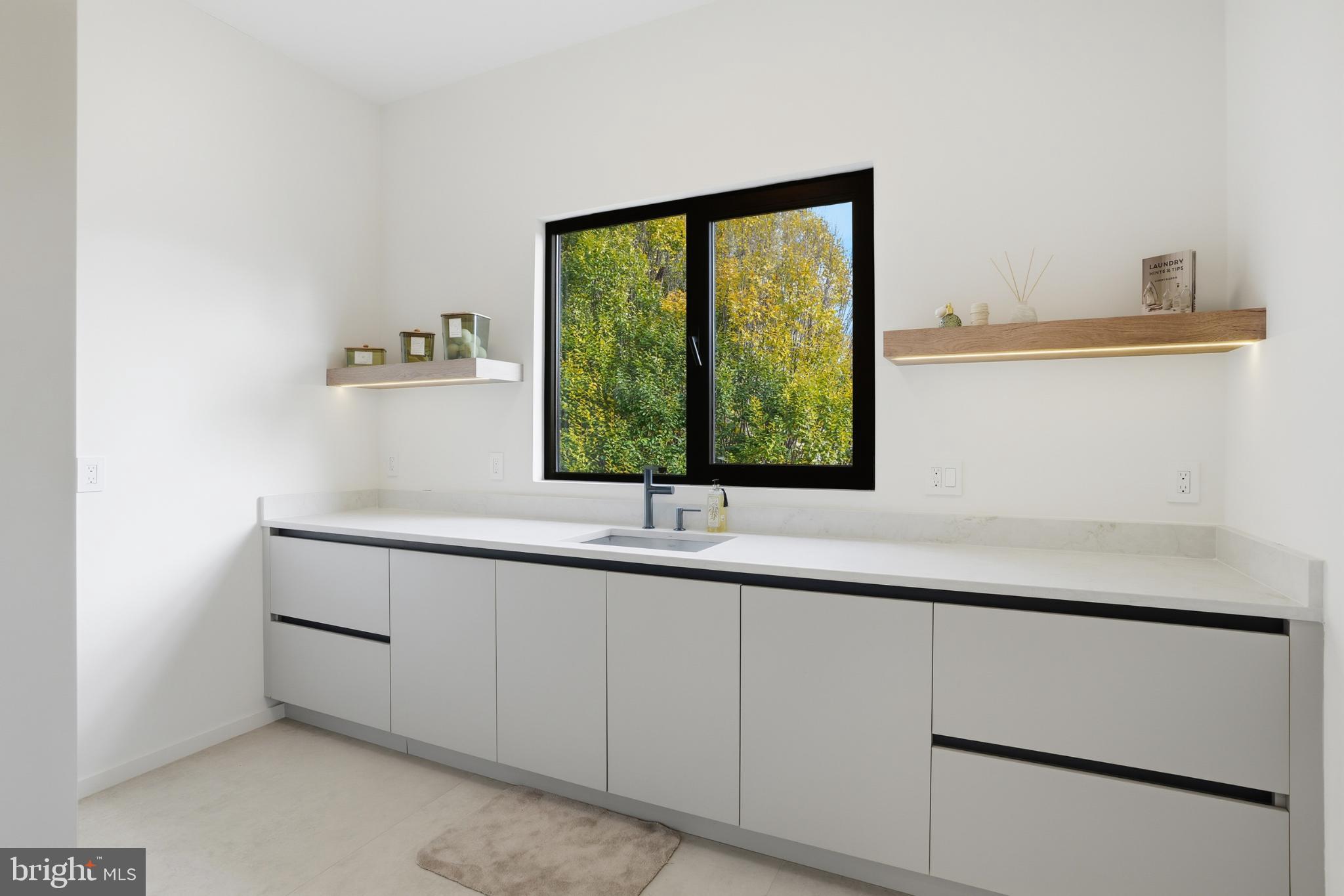 9408 Old Courthouse Road Vienna, VA 22182 - Photo 41 of 92 Sleek kitchen with serene nature views.