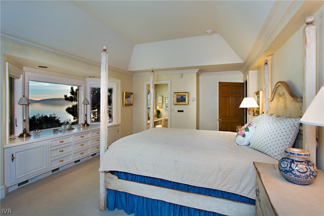 1165 Lakeshore Boulevard Incline Village, NV 89451 - Photo 16 of 25 a bedroom with a bed and a large mirror