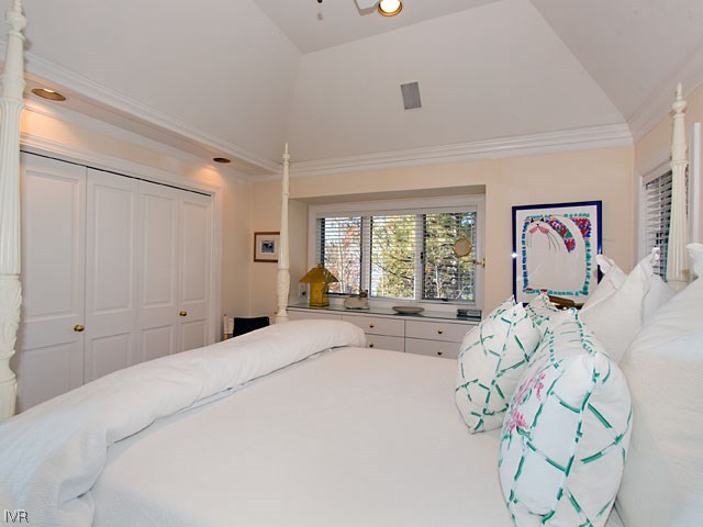1165 Lakeshore Boulevard Incline Village, NV 89451 - Photo 23 of 25 a spacious bedroom with a bed and glass window