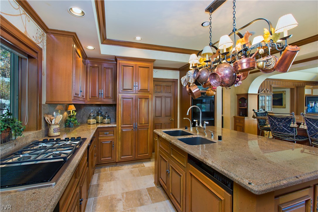 1165 Lakeshore Boulevard Incline Village, NV 89451 - Photo 8 of 25 a kitchen with kitchen island granite countertop a stove a sink a refrigerator dining table and chairs
