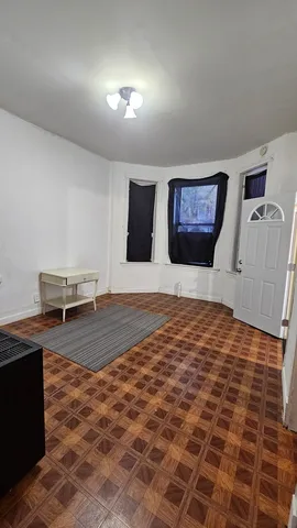 a bedroom with a bed and a view of balcony