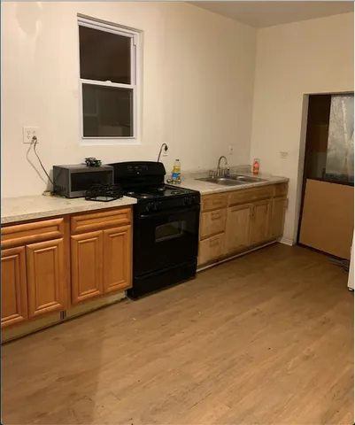 a kitchen with a sink and cabinets