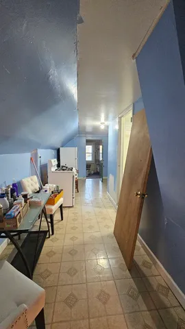 a lobby with furniture and a rug