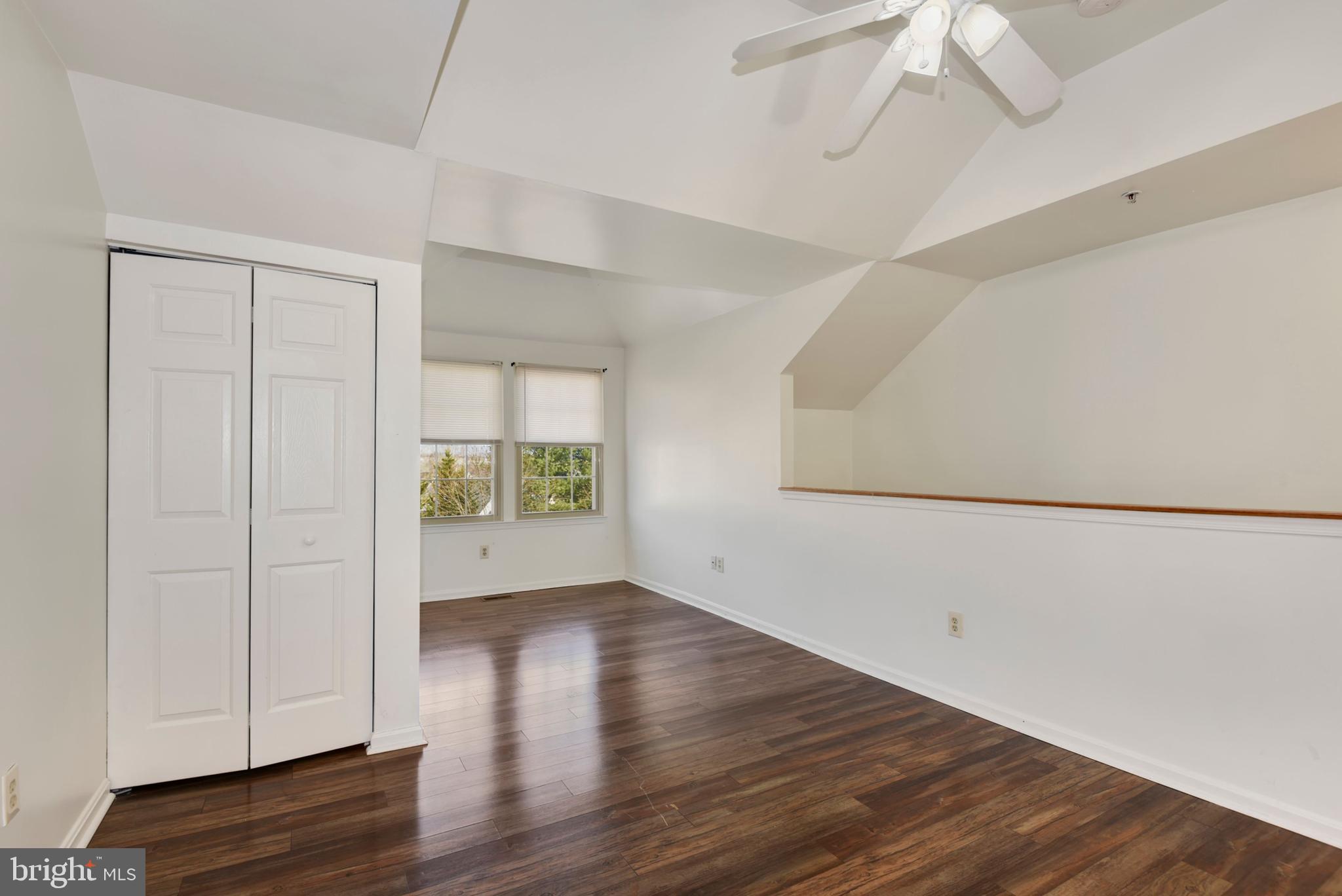 43 Bank Spring Court Owings Mills, MD 21117 - Photo 22 of 27 a view of an empty room with wooden floor and a window