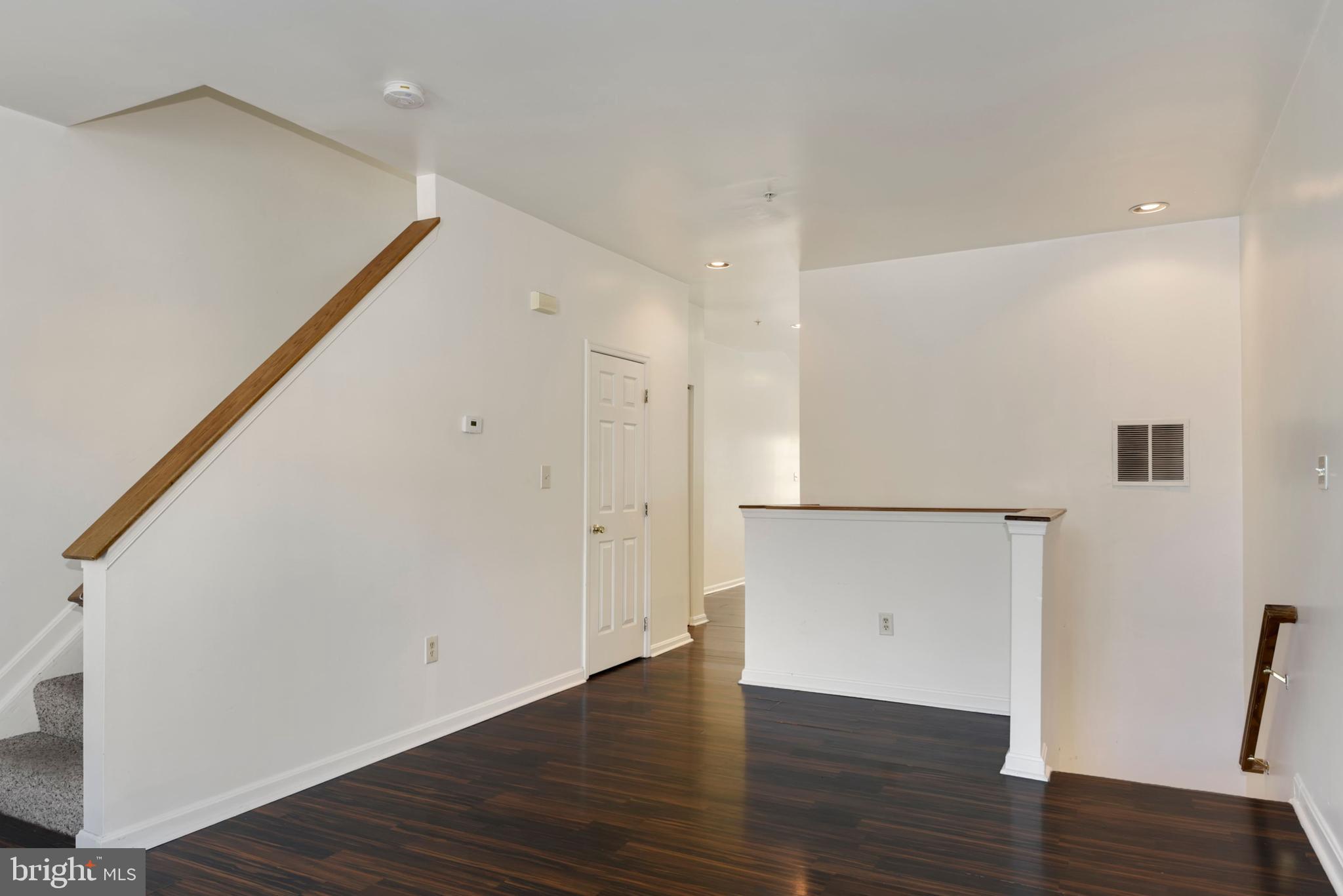 43 Bank Spring Court Owings Mills, MD 21117 - Photo 7 of 27 a view of an empty room with wooden floor