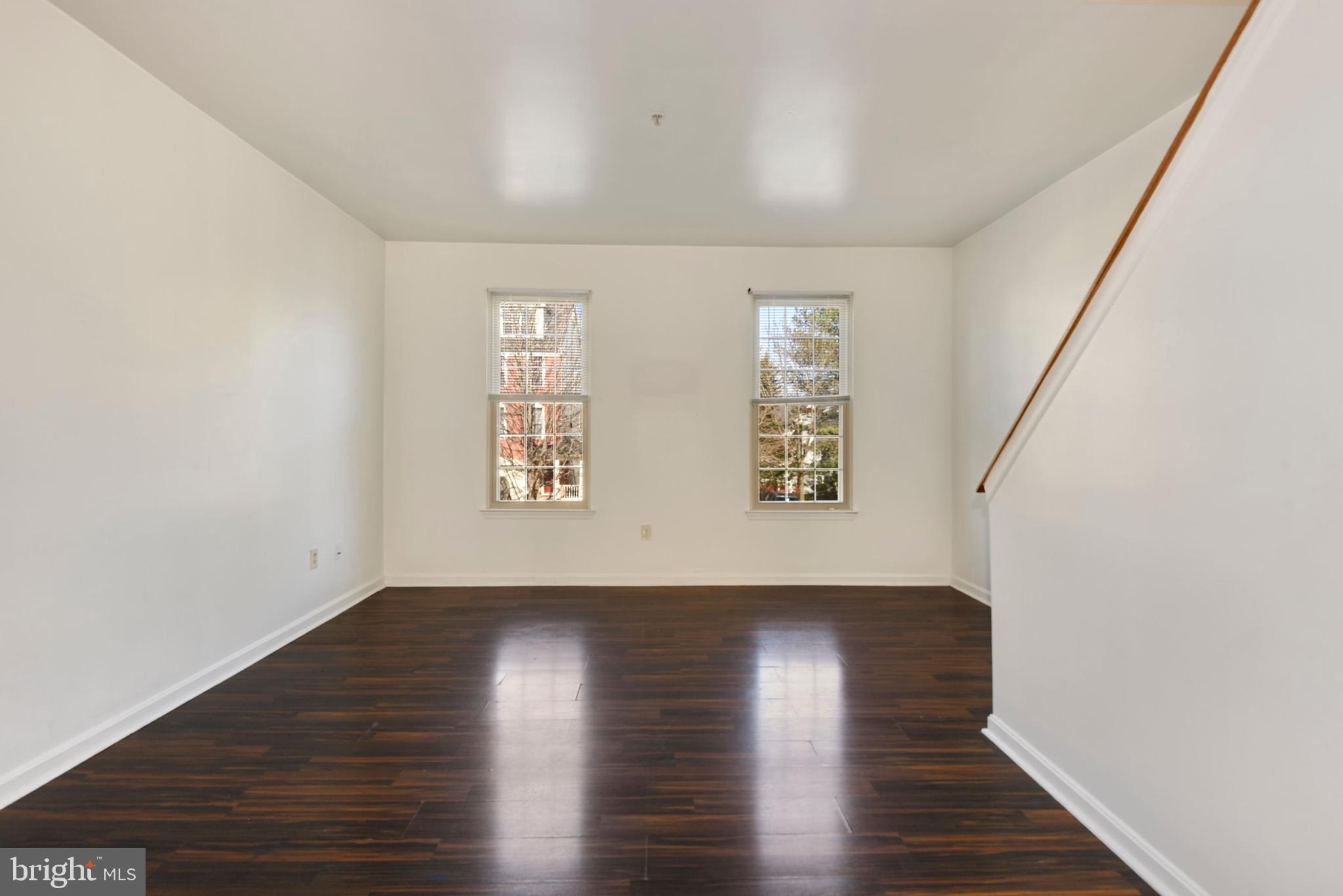 43 Bank Spring Court Owings Mills, MD 21117 - Photo 10 of 27 a view of an empty room with wooden floor and a window