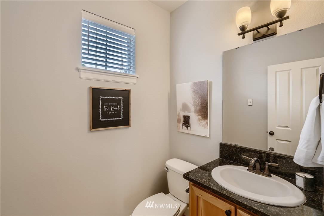 320 Chelan Place Northeast, Unit H3 Renton, WA 98059 - Photo 14 of 28 a bathroom with a sink toilet and mirror
