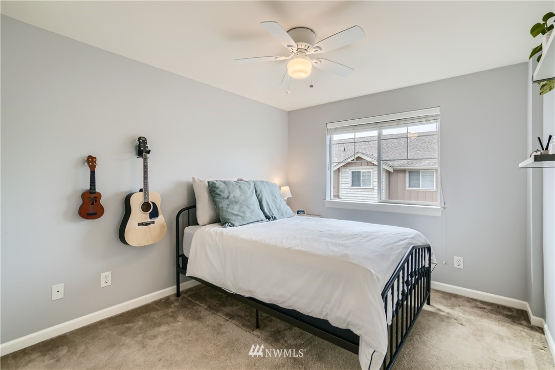 320 Chelan Place Northeast, Unit H3 Renton, WA 98059 - Photo 20 of 28 a bedroom with a bed and a window