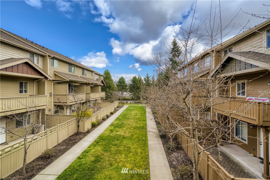 320 Chelan Place Northeast, Unit H3 Renton, WA 98059 - Photo 27 of 28 a view of a large building with many windows