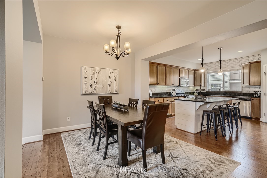 320 Chelan Place Northeast, Unit H3 Renton, WA 98059 - Photo 9 of 28 a view of a dining room with furniture