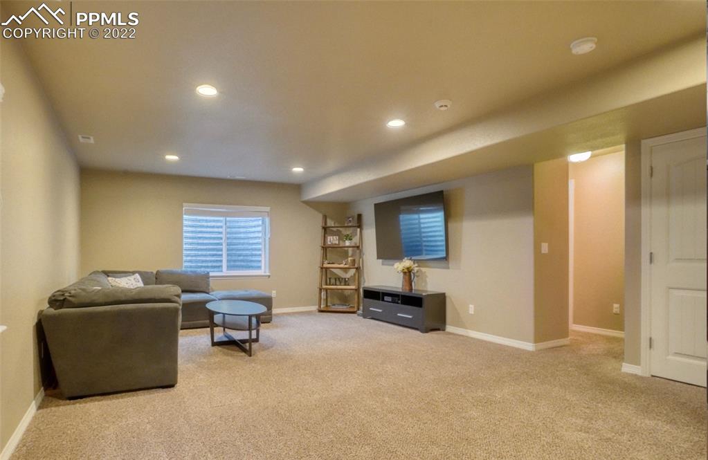 6729 Kearsarge Drive Colorado Springs, CO 80925 - Photo 14 of 22 a view of a livingroom with workspace and a window