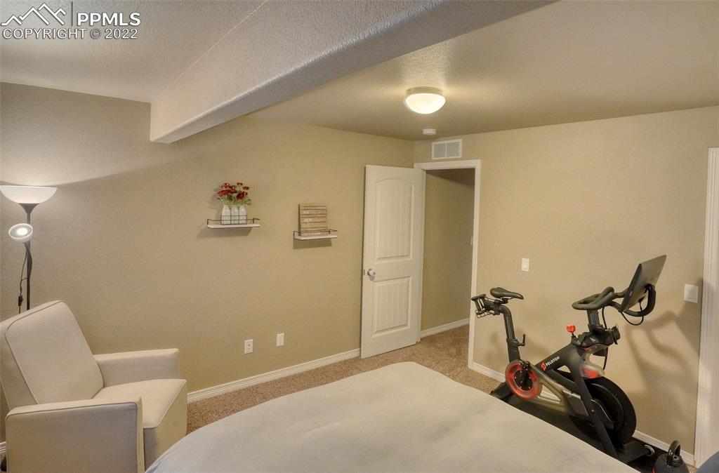 6729 Kearsarge Drive Colorado Springs, CO 80925 - Photo 19 of 22 a view of a room with gym equipment