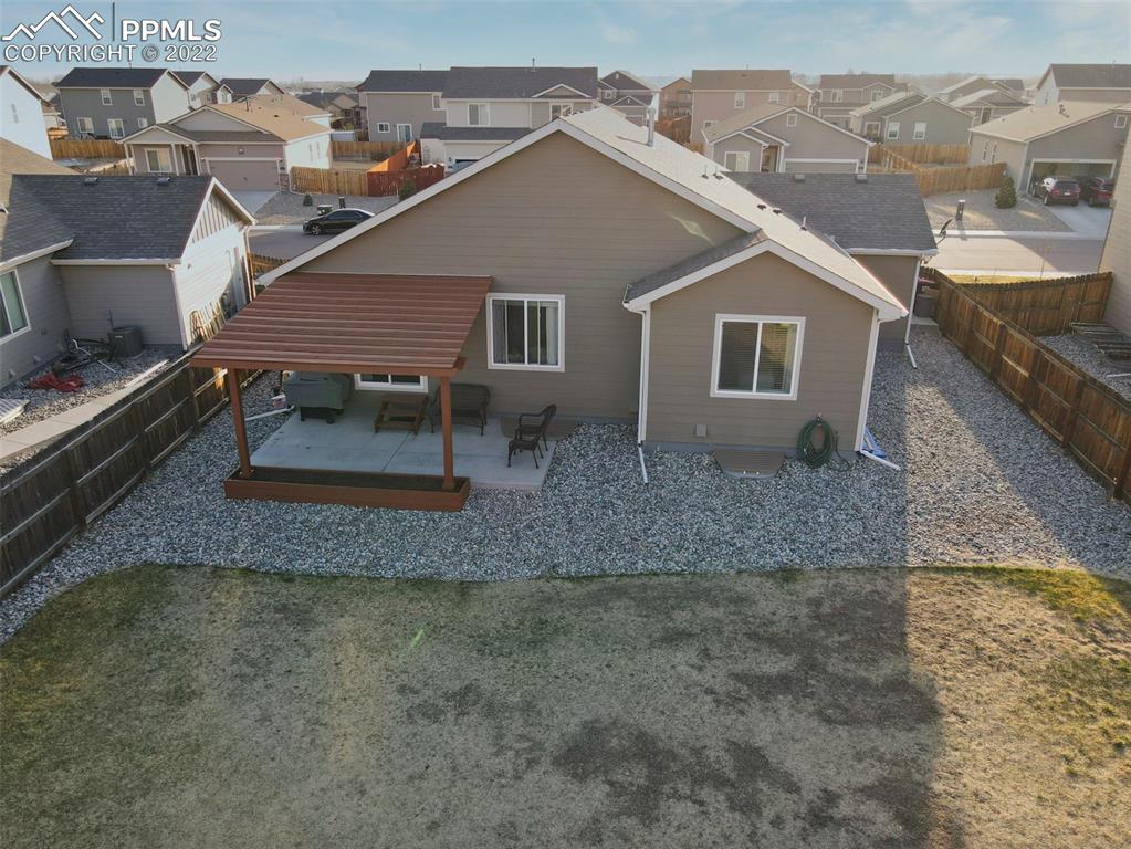 6729 Kearsarge Drive Colorado Springs, CO 80925 - Photo 21 of 22 a house view with a backyard space