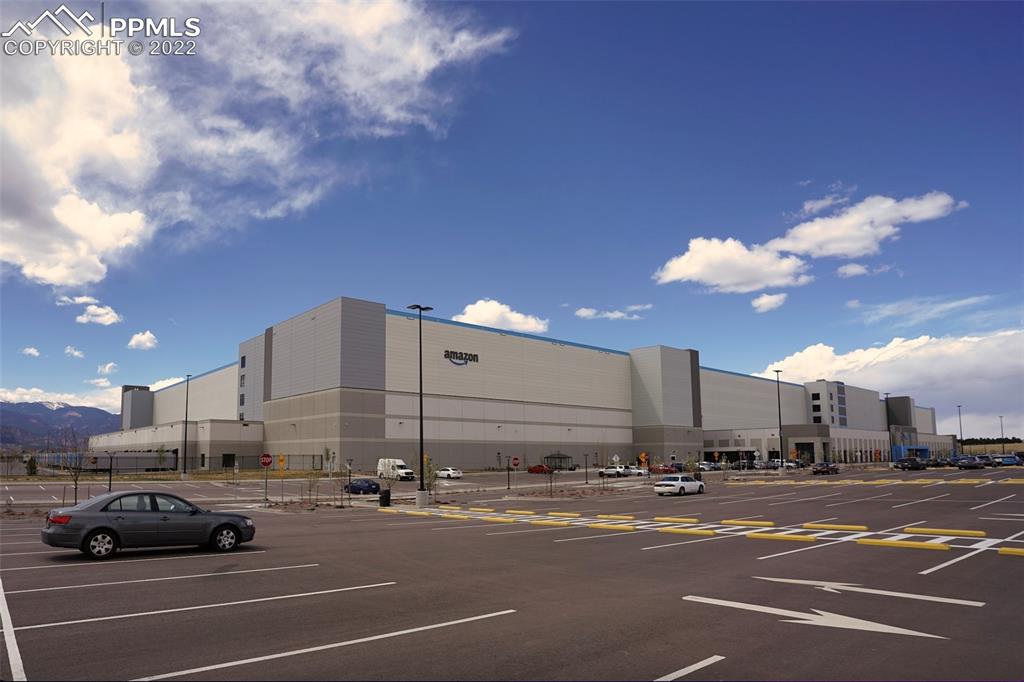 6729 Kearsarge Drive Colorado Springs, CO 80925 - Photo 22 of 22 a view of a cars parked in a parking lot