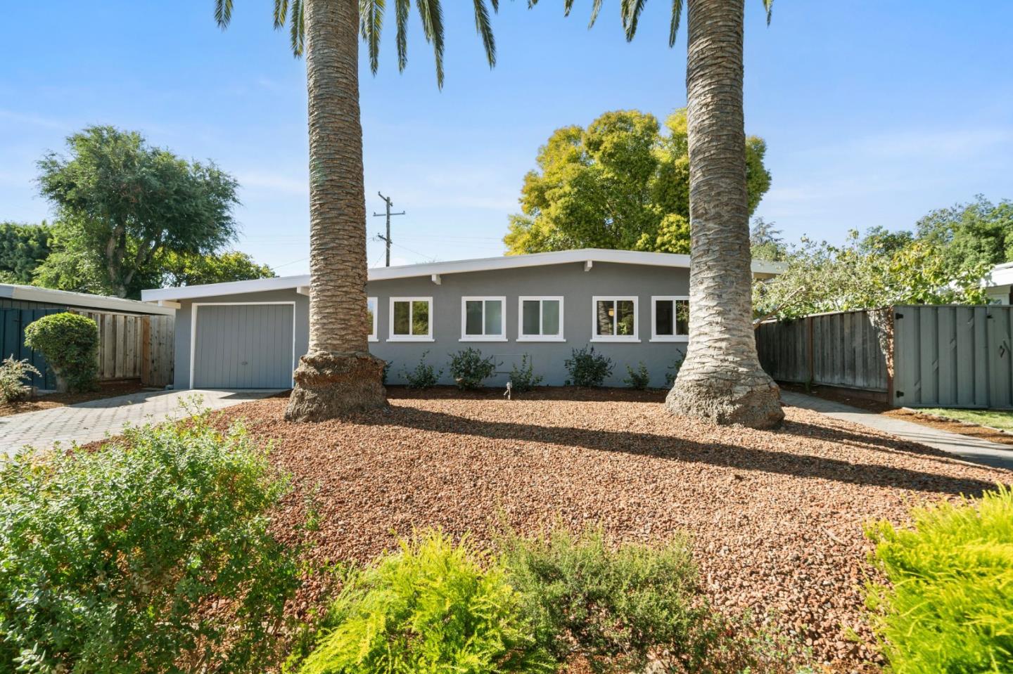 2409 Laura Lane Mountain View, CA 94043 - Photo 1 of 26 a front view of a house with a yard
